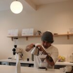 barista preparing V60 behind the bar